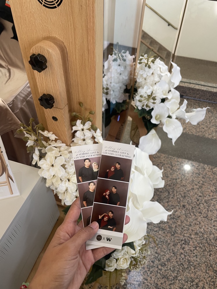 Printed photobooth strip keepsake from a wedding showcase